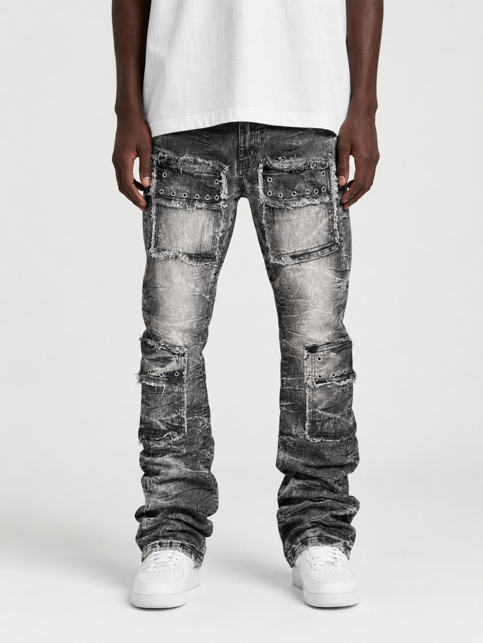 FWRD Eyelet Stacked Denim jeans in washed black, showcasing distressed denim with eyelet details and stacked leg design.