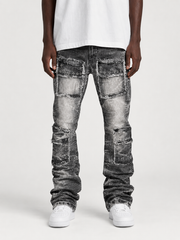 FWRD Eyelet Stacked Denim jeans in washed black, showcasing distressed denim with eyelet details and stacked leg design.