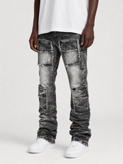FWRD Eyelet Stacked Denim in washed black showing layered, distressed denim fabric with eyelet details and a high-waisted fit.