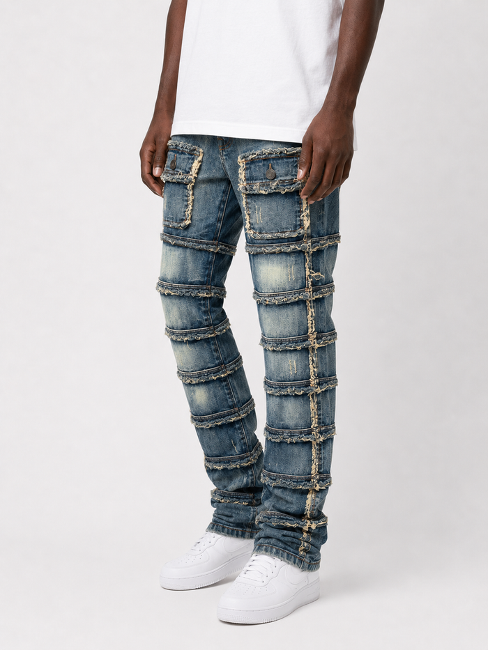 FWRD Patchwork True Stacked Denim jeans in light tint with multicolored patchwork design and stacked fit.
