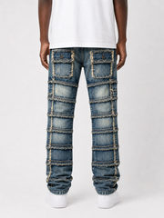 FWRD Patchwork True Stacked Denim jeans in light tint with patchwork design and stacked style, showcasing denim fabric and stitching details.