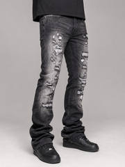 FWRD Worn Down stacked flare denim jeans in washed black with distressed details and rolled cuffs, showcasing a trendy denim style.