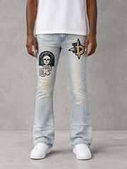 Blue denim KDNK Patch & Print Flared Pants with distressed details and unique patchwork design.