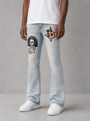Blue denim flared pants by KDNK with patch and print details, featuring a stylish high-waist design and wide leg silhouette.