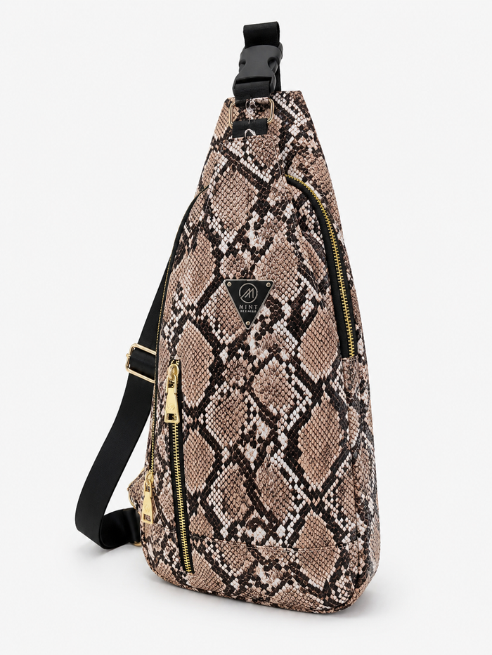 Tan Mint Cobra snakeskin sling backpack with adjustable straps and compact design for stylish everyday use.