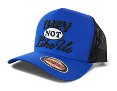 MUKA They Not Like Us trucker hat in royal blue and black with mesh back and curved brim, casual streetwear accessory.