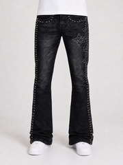 Black denim flared jeans with cross-stud details from Original Fables, featuring a cross-flared leg style and classic denim texture.