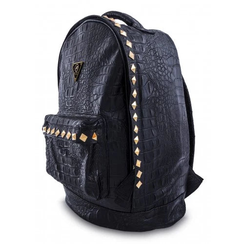 Black crocodile-embossed studded backpack from Mint Accessories, showing side view with adjustable straps and textured surface.