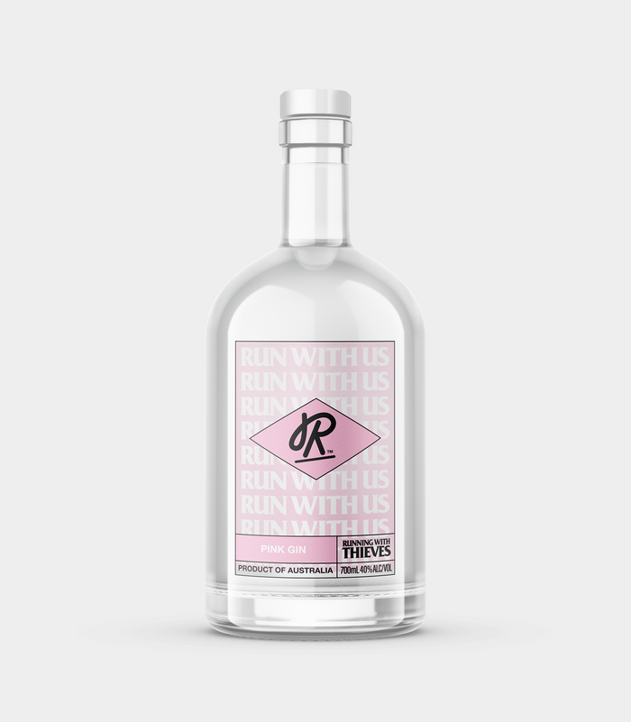 A clear bottle containing pink gin with a label that includes the text 'Thieves' and the name of the product.
